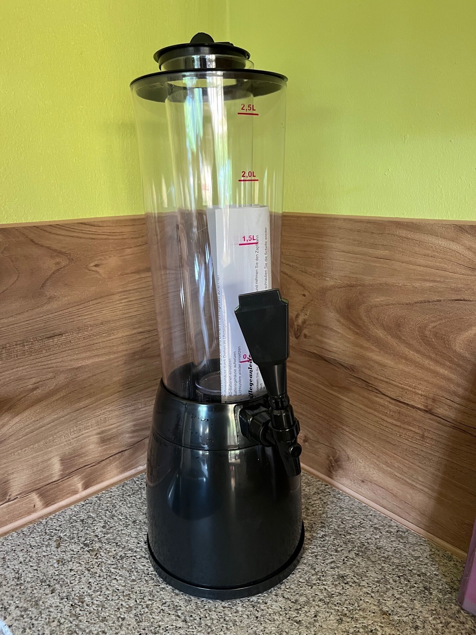 A blender with a transparent container, measuring markings, and a black base.