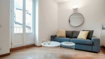 Apartment, Balcony, Partial Lake View | Living room | 30-inch TV with digital channels