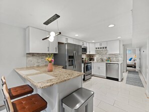 Fridge, microwave, oven, stovetop - Bright Garden-Level DC 1BR Condo| King Bed | W/D (Washington)