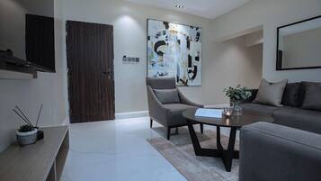 Economy Room, Balcony, City View | Living area | TV