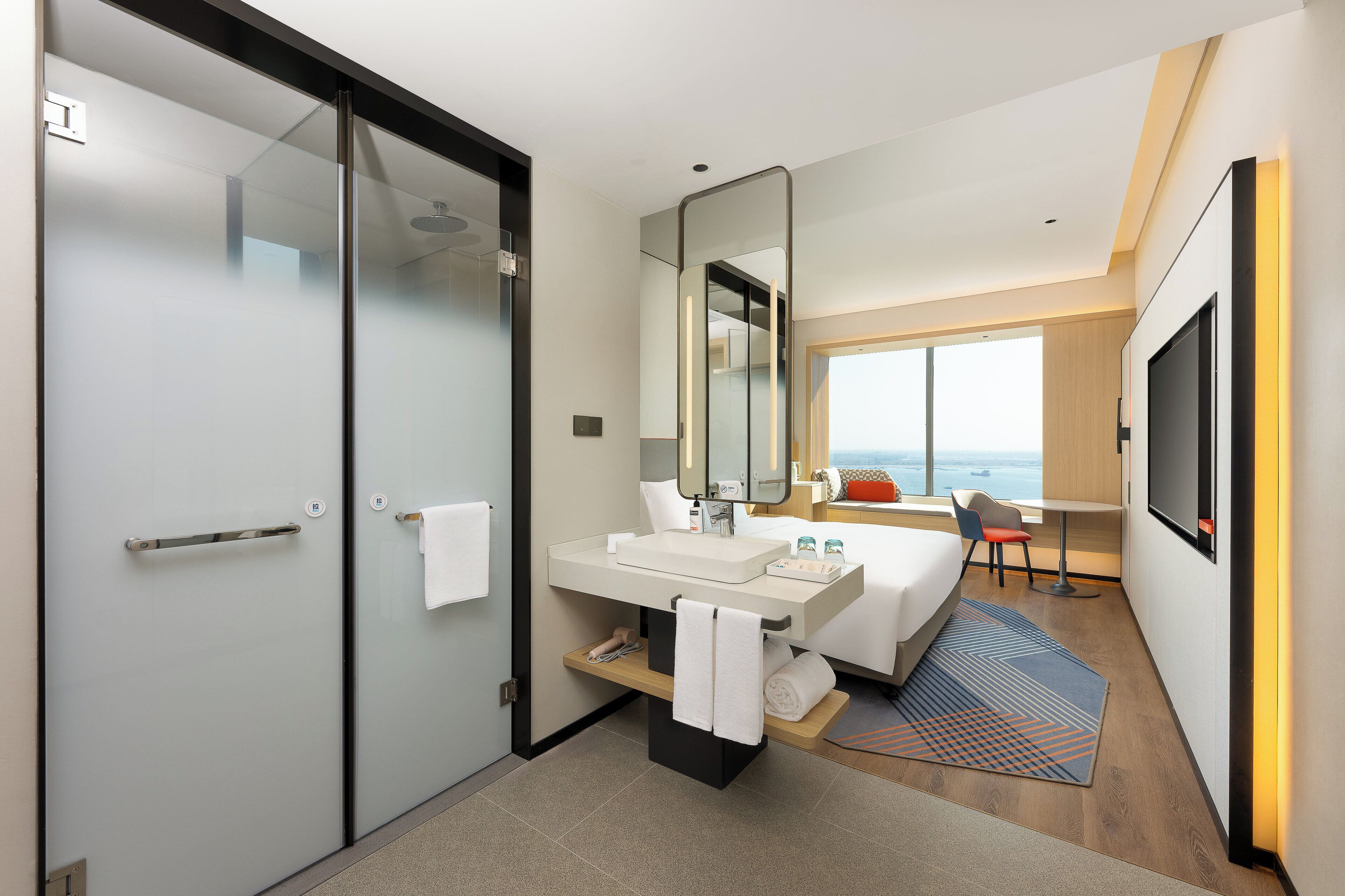 Down comforters, desk, blackout drapes, free cribs/infant beds