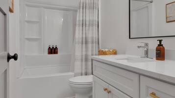 Hair dryer, towels, soap, shampoo