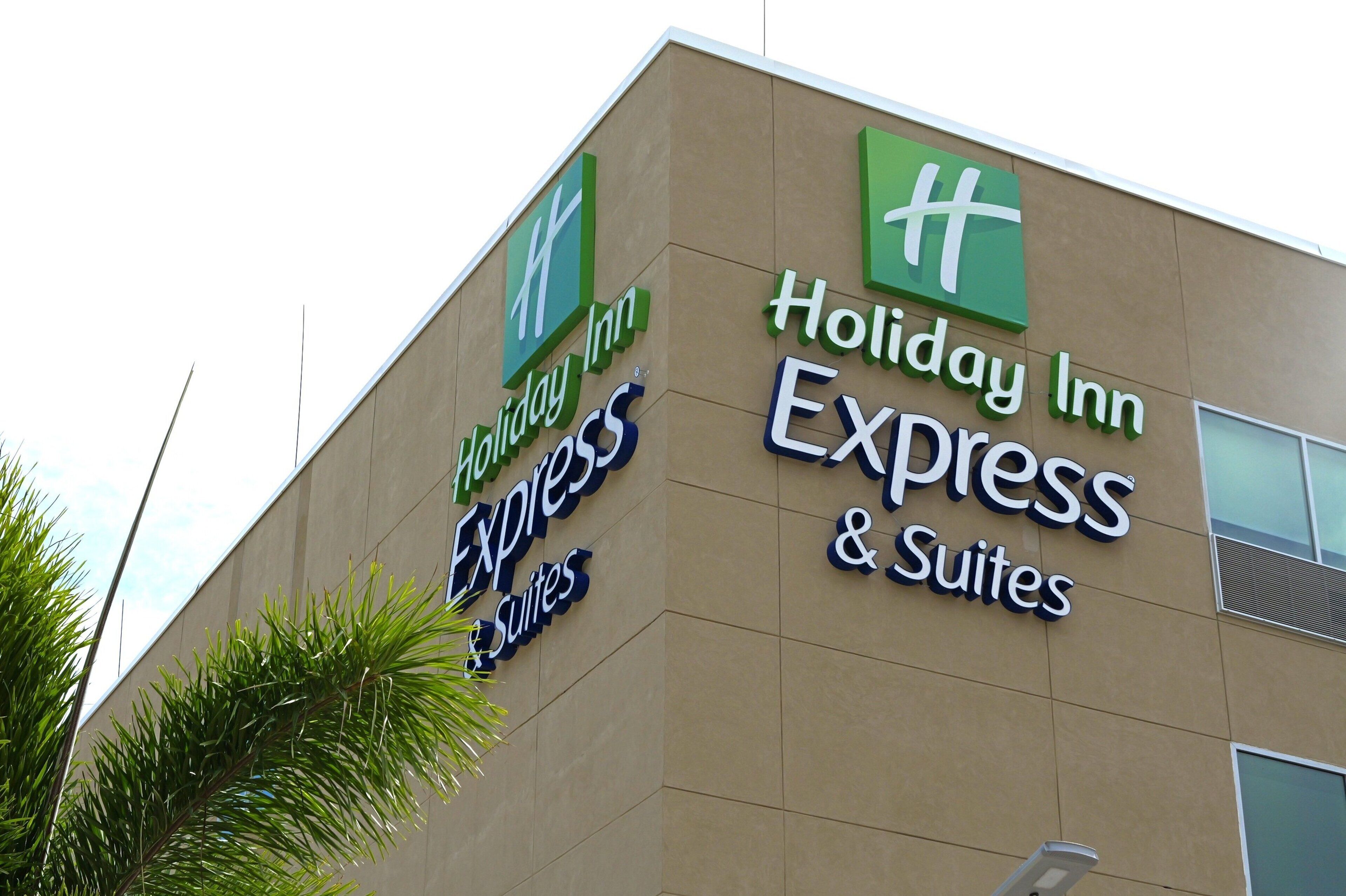 A Holiday Inn Express & Suites sign on a building.