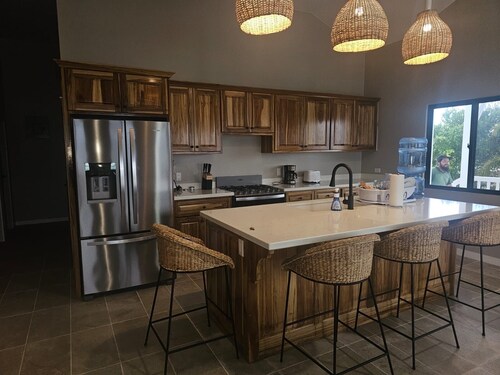 Modern 3-bedroom waterfront lagoon house with Wi-Fi, AC in beautiful Maya Beach.