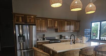 Modern 3-bedroom waterfront lagoon house with Wi-Fi, AC in beautiful Maya Beach.