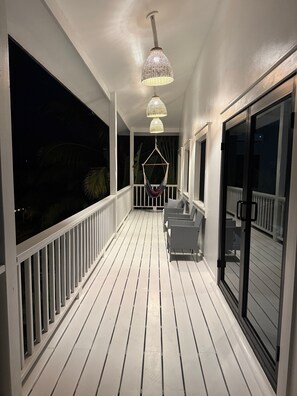Terrace/patio - Modern 3-bedroom waterfront lagoon house with Wi-Fi, AC in beautiful Maya Beach. (Placencia)