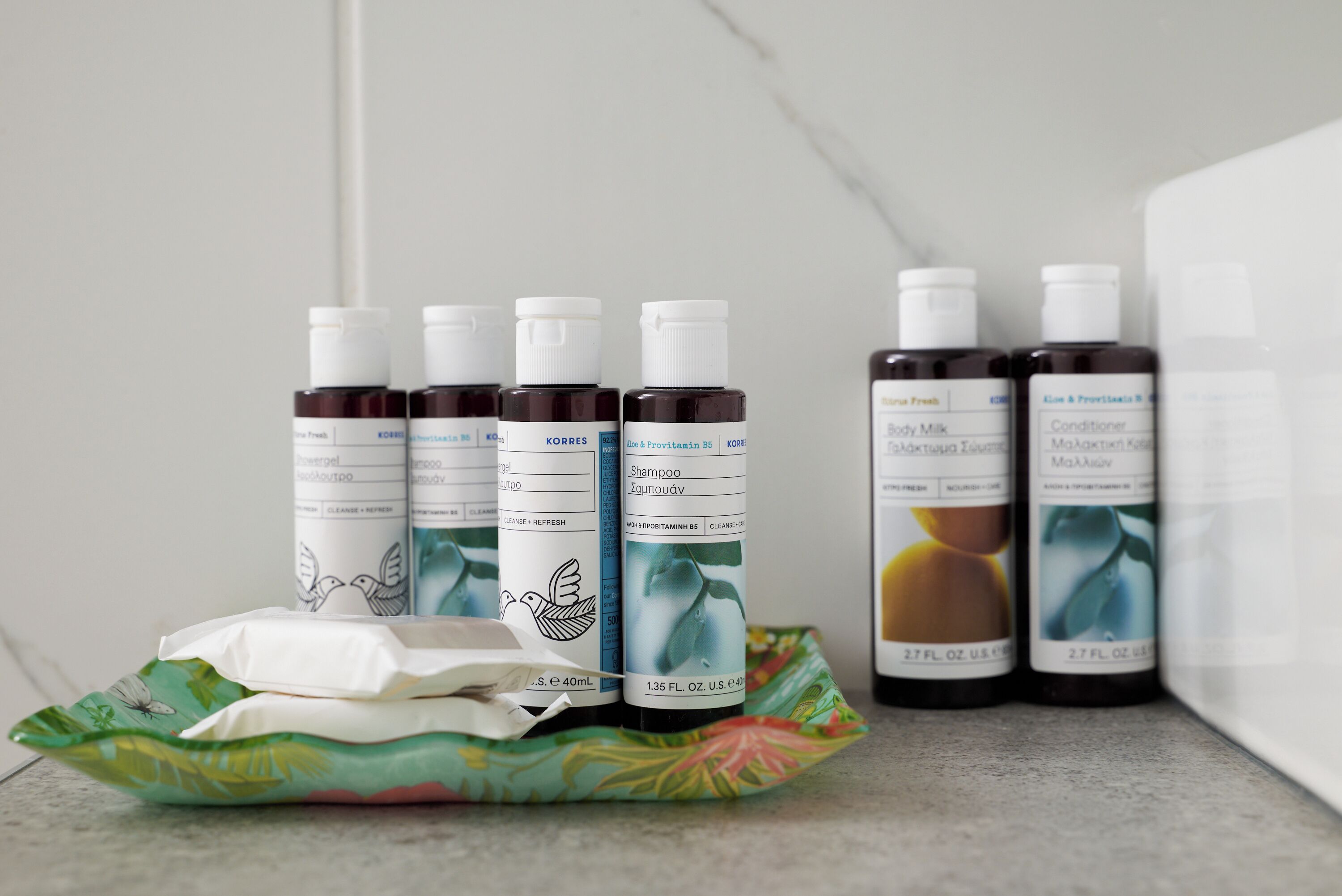 A set of personal care products on a tray.