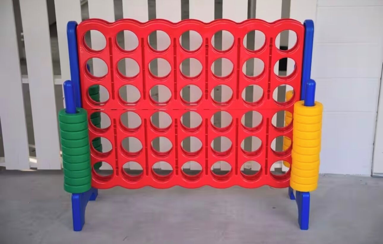 A red and blue plastic obstacle course with circular holes.