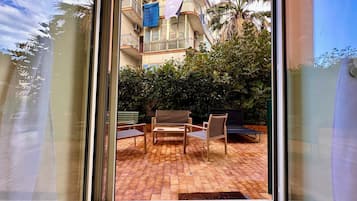 Exclusive Apartment, City View | Living area | Flat-screen TV