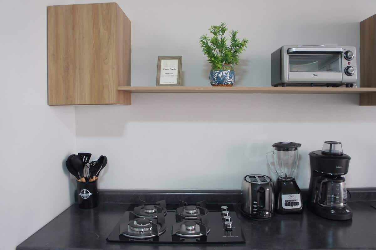 Microwave, coffee/tea maker, blender, cookware/dishes/utensils