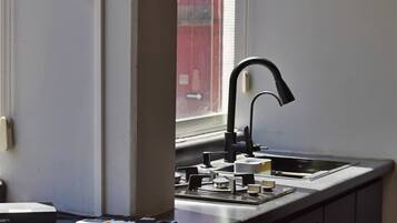 Fridge, microwave, stovetop, coffee/tea maker