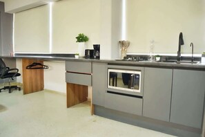 Fridge, microwave, stovetop, coffee/tea maker