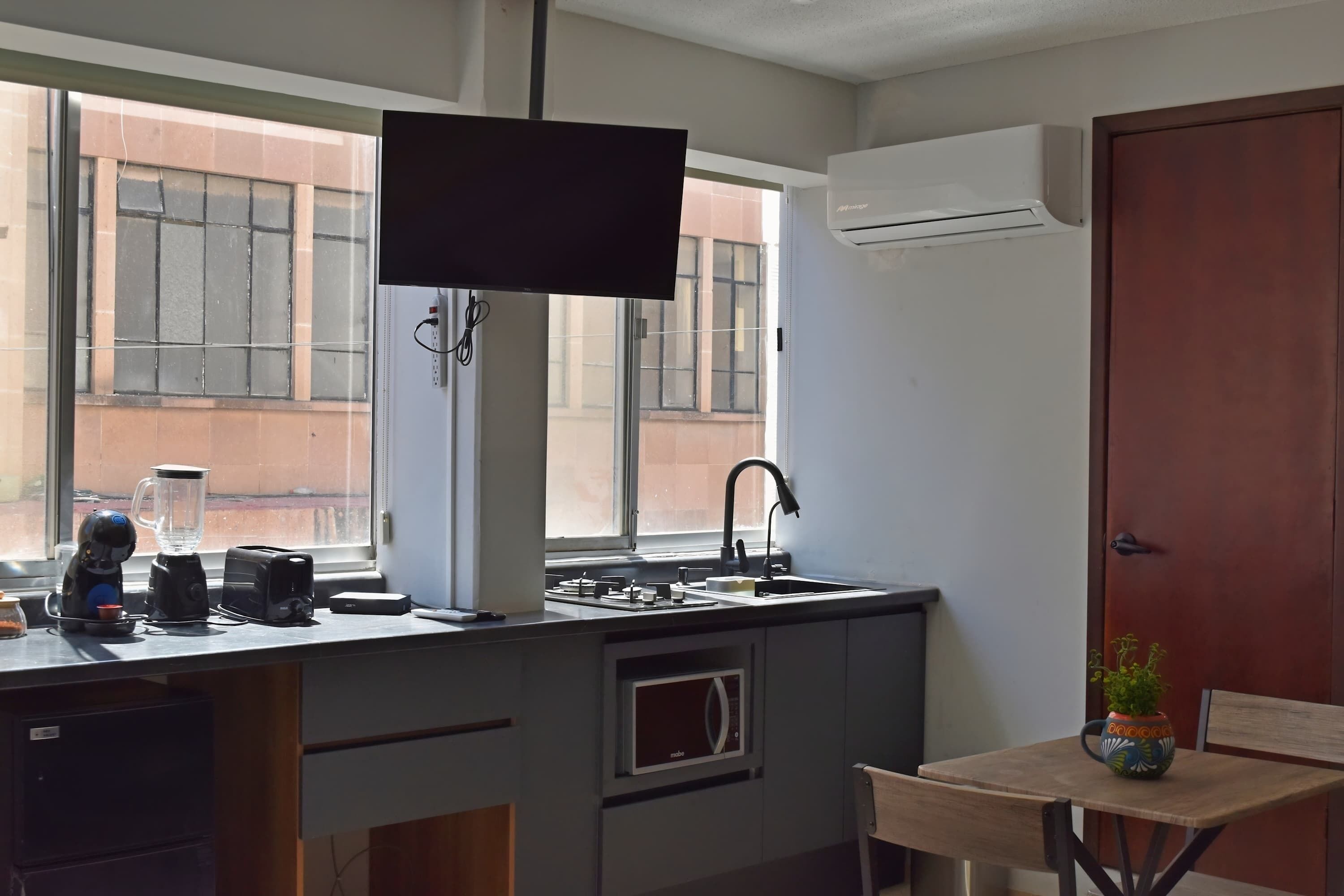 Fridge, microwave, stovetop, coffee/tea maker