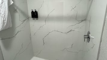 Shower, towels, soap, shampoo