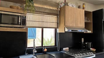 Microwave, coffee/tea maker, cookware/dishes/utensils