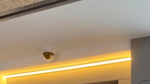 A modern elevator with a digital control panel and a number 2 on the wall. - MYO Barcelona Hotel & Apartments (Castelldefels)