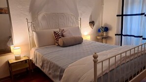Cozy retreat with a single bed, bedside table, and elegant headboard.
