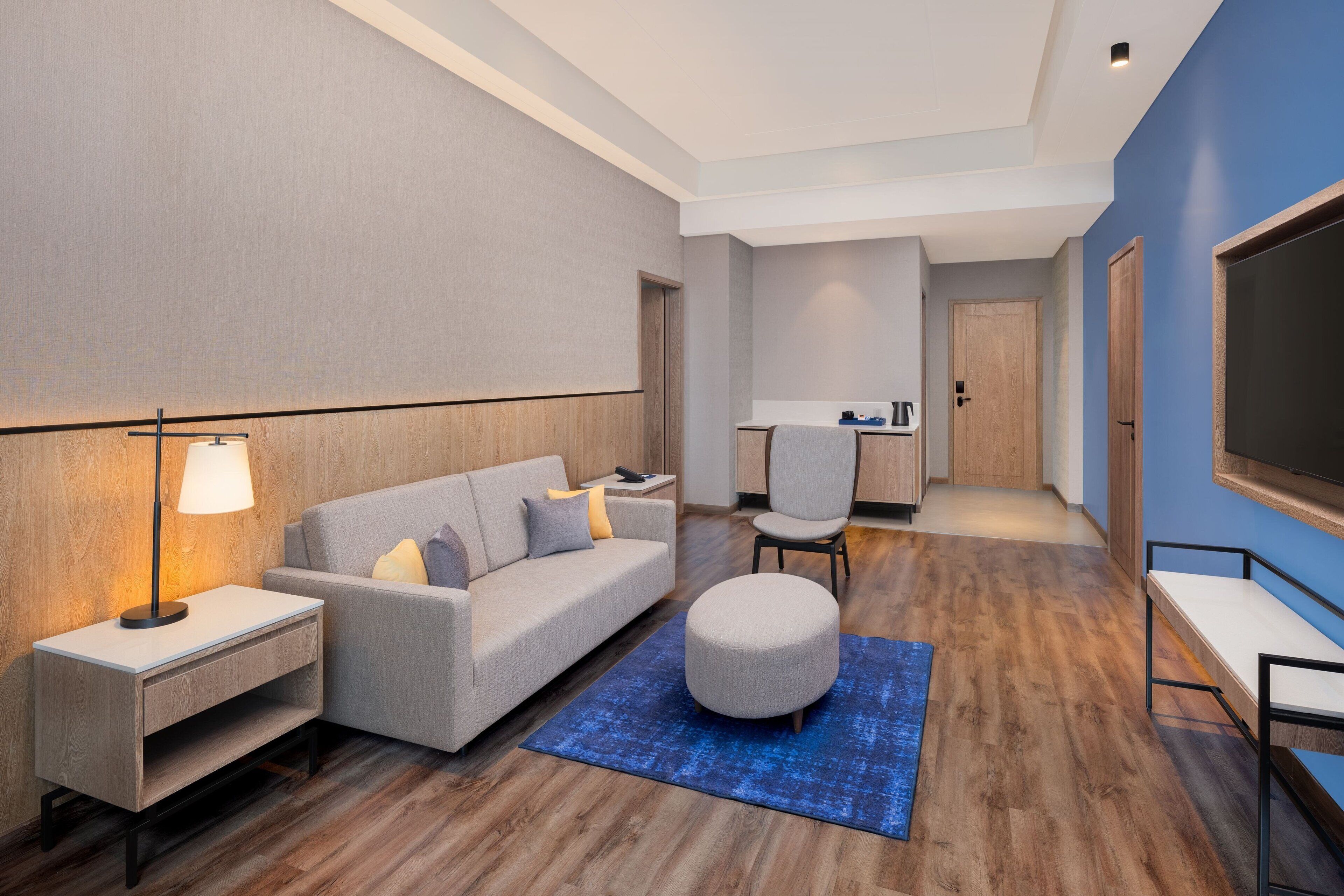Suite, 1 King Bed, City View | Living room | 54-inch Smart TV with digital channels