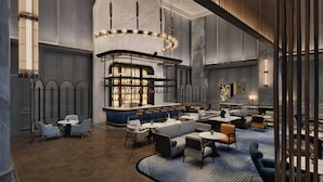 A spacious lobby with a bar area, seating arrangements, and a patterned floor. - Le Meridien Nantong (Nantong)