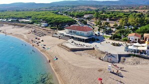 A coastal hotel with a beach view, a pool area, and a restaurant. - DOMO 101 - Deluxe Junior Suite with Sea View (Aglientu)