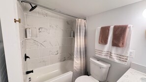 Jetted tub, hair dryer, towels, soap