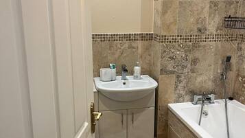 Shower, towels, soap, toilet paper