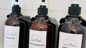 Shower, towels, soap, toilet paper