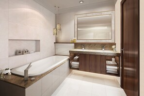 Enjoy a relaxing soak in the bathtub, accompanied by ample storage and natural light.