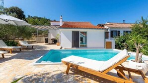 A modern villa with a swimming pool, outdoor seating, and a garden. - Amazing home in Dracevica (Dracevica)
