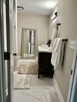Shower, hair dryer, towels, soap