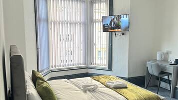 Deluxe Double Room, Private Bathroom, Ocean View | Desk, laptop workspace, soundproofing, iron/ironing board