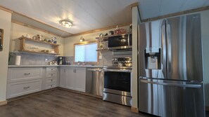 Fridge, microwave, oven, stovetop - Hillcrest Hideaway: Spacious Mountain View Oasis (Crowsnest Pass)