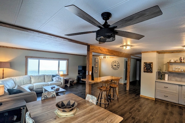 Kitchen, dining, bar/island and living room all connect in this open concept space.