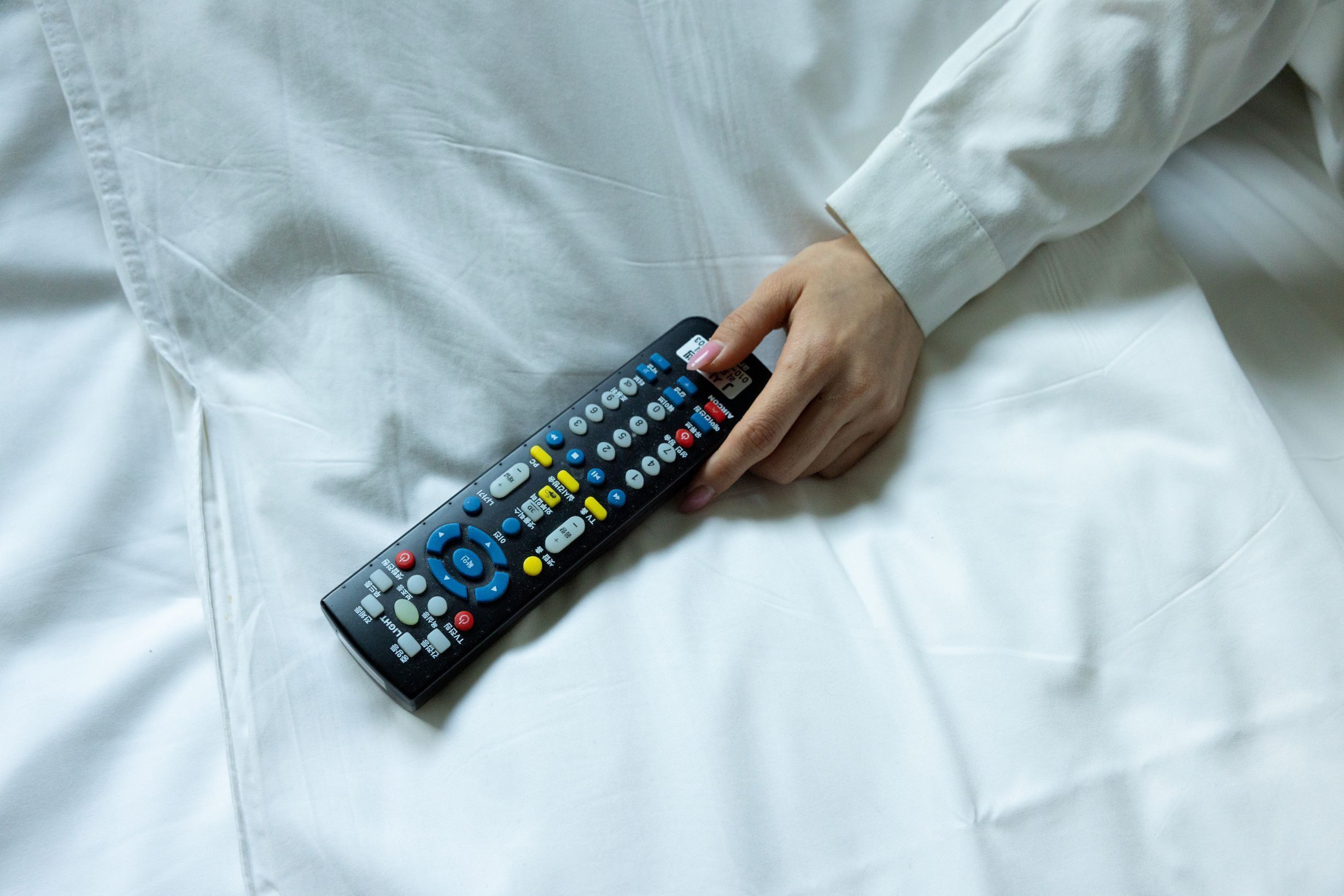 A person holding a remote control.