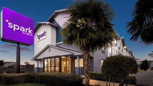 A hotel with a prominent 'spark by Hilton' sign, modern architecture, and well-maintained landscaping. - Spark by Hilton Norfolk (Norfolk)
