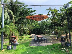 A sign for "Hestav Lagi" with a contact number. - Homestay Lagi (Phuoc Hoi)