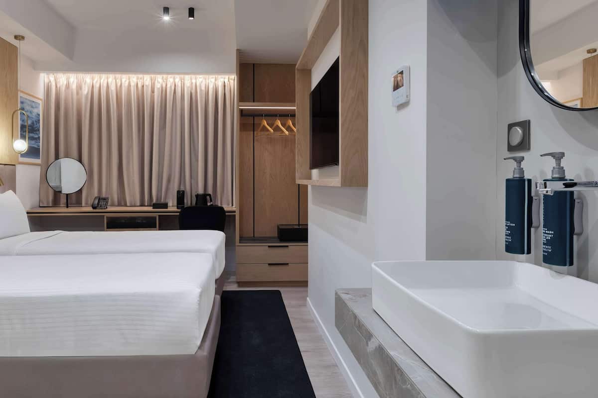 Chambre avec lits jumeaux, 2 lits jumeaux | Système dâinsonorisation, accès au Wi-Fi (inclus), literie fournie