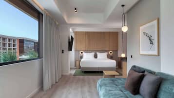 Junior Suite, 1 King Bed | Living area | 55-inch TV with digital channels