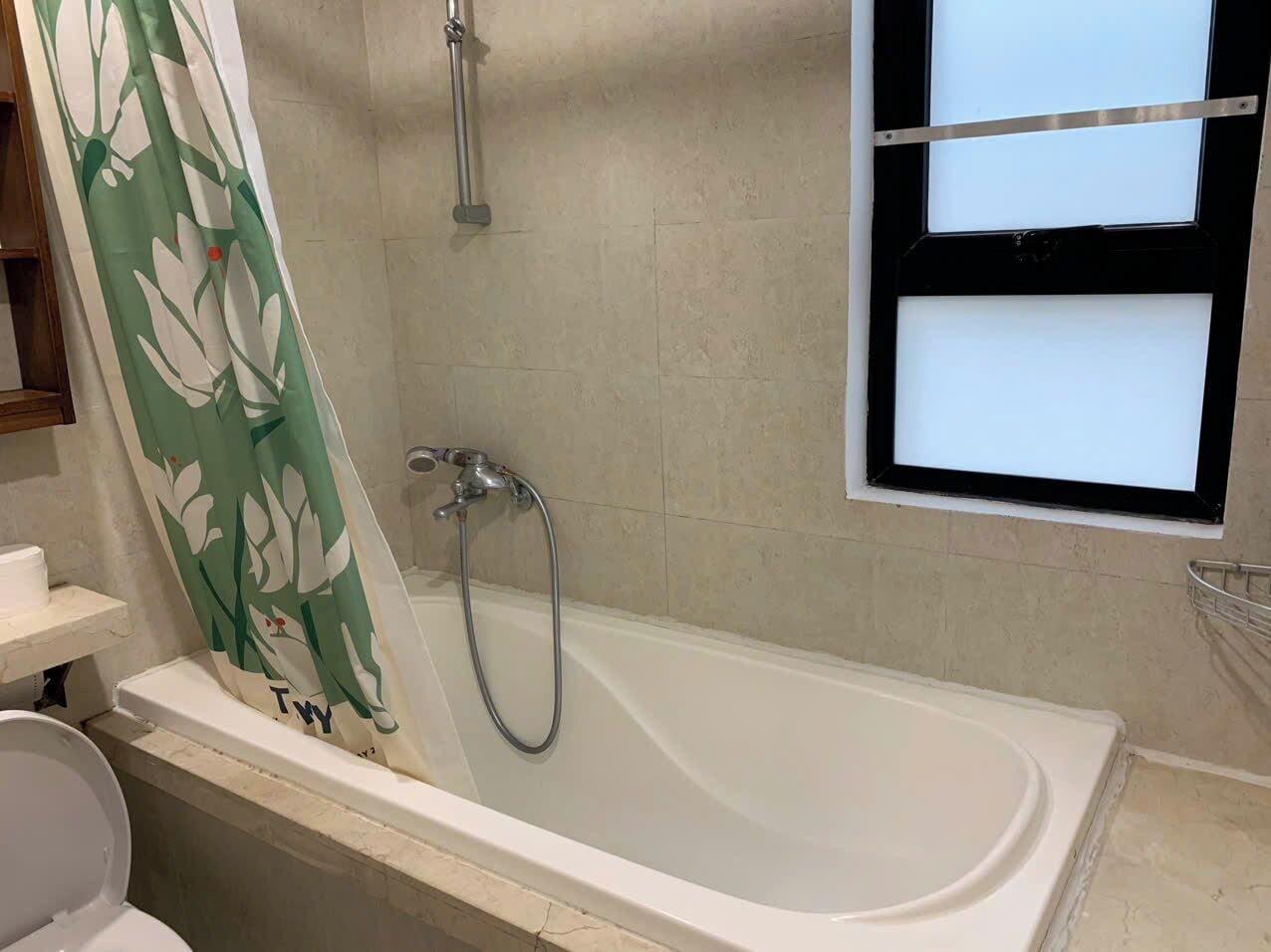 Separate tub and shower, hair dryer, slippers, towels