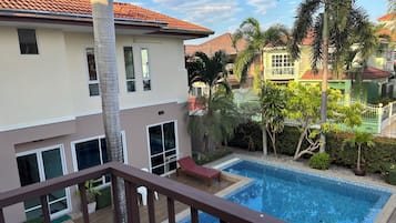 Enjoy a peaceful living environment with a pool and garden.