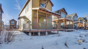 A multi-story residential building with a covered porch and a balcony. - 4 Mi to Granby Ranch: Cabin w/ Hot Tub Access! (Granby)