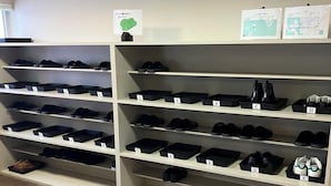A shoe storage area with multiple shelves labeled with numbers. - Train Line Field (Tobetsu)