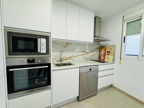 Fridge, microwave, dishwasher, coffee/tea maker