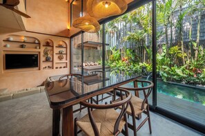 Deluxe Villa, Private Pool, Pool View | Dining room - The Mystik Loft Harmony (Canggu)