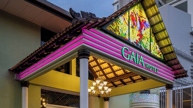 The exterior of the GAIA HOTEL with a colorful stained glass entrance and a traditional tiled roof. - GAIA Hotel (George Town)