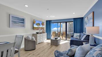 Signature Condo, 1 Bedroom, Balcony, City View | Living room | 60-inch Smart TV with digital channels