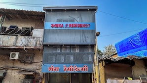 A building with a sign reading "Shera Residency" and another sign in a different language. - Hotel Shera Residency (Mumbai)