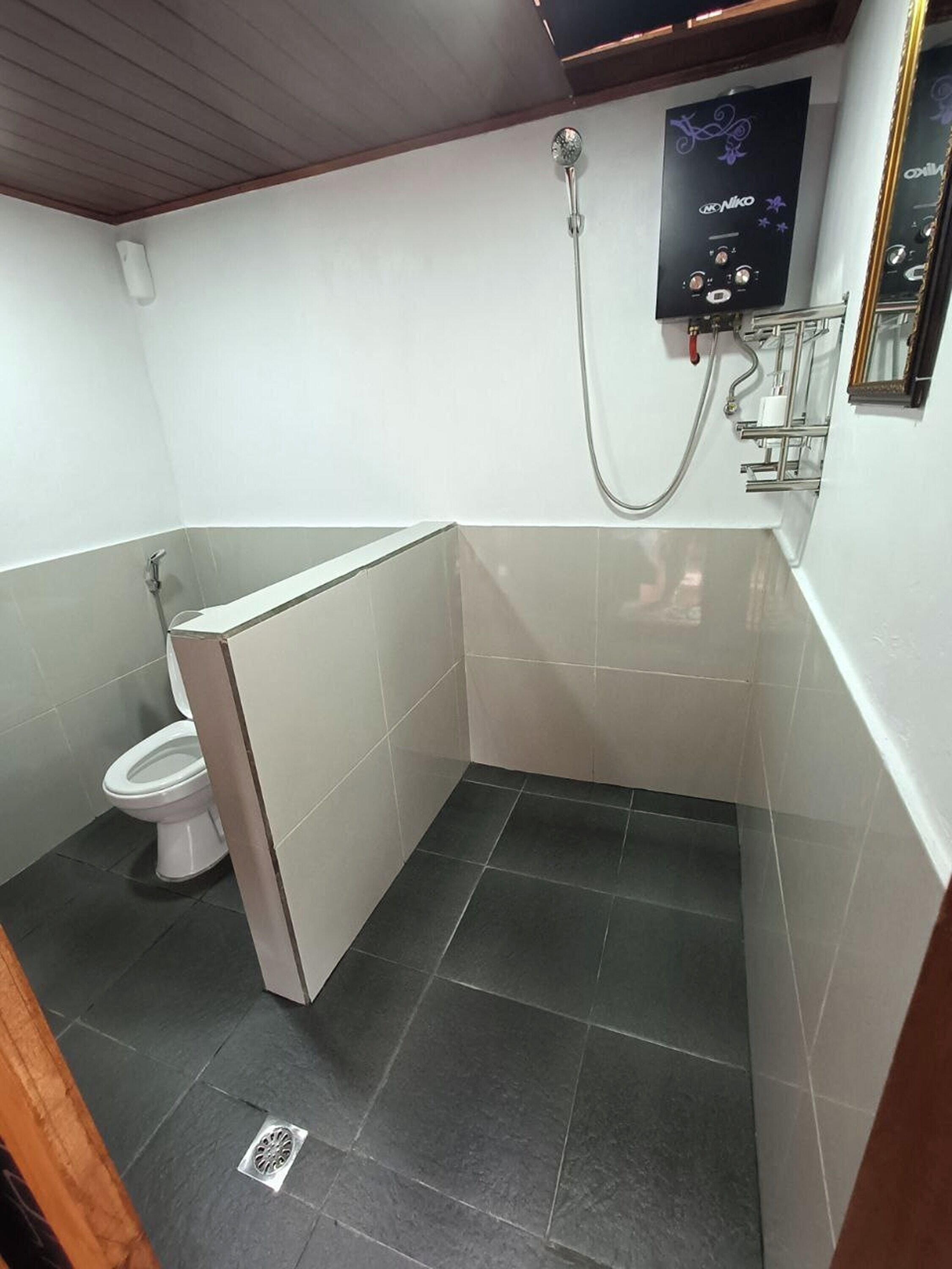 Habitación Deluxe | Baño | Ducha y cabezal de ducha tipo lluvia