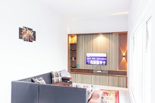 Villa | Living area | 32-inch LCD TV with cable channels