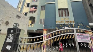A multi-story building with a sign for "Caliph International School" and a "No Parking" sign. - duplexhotel (Hyderabad)